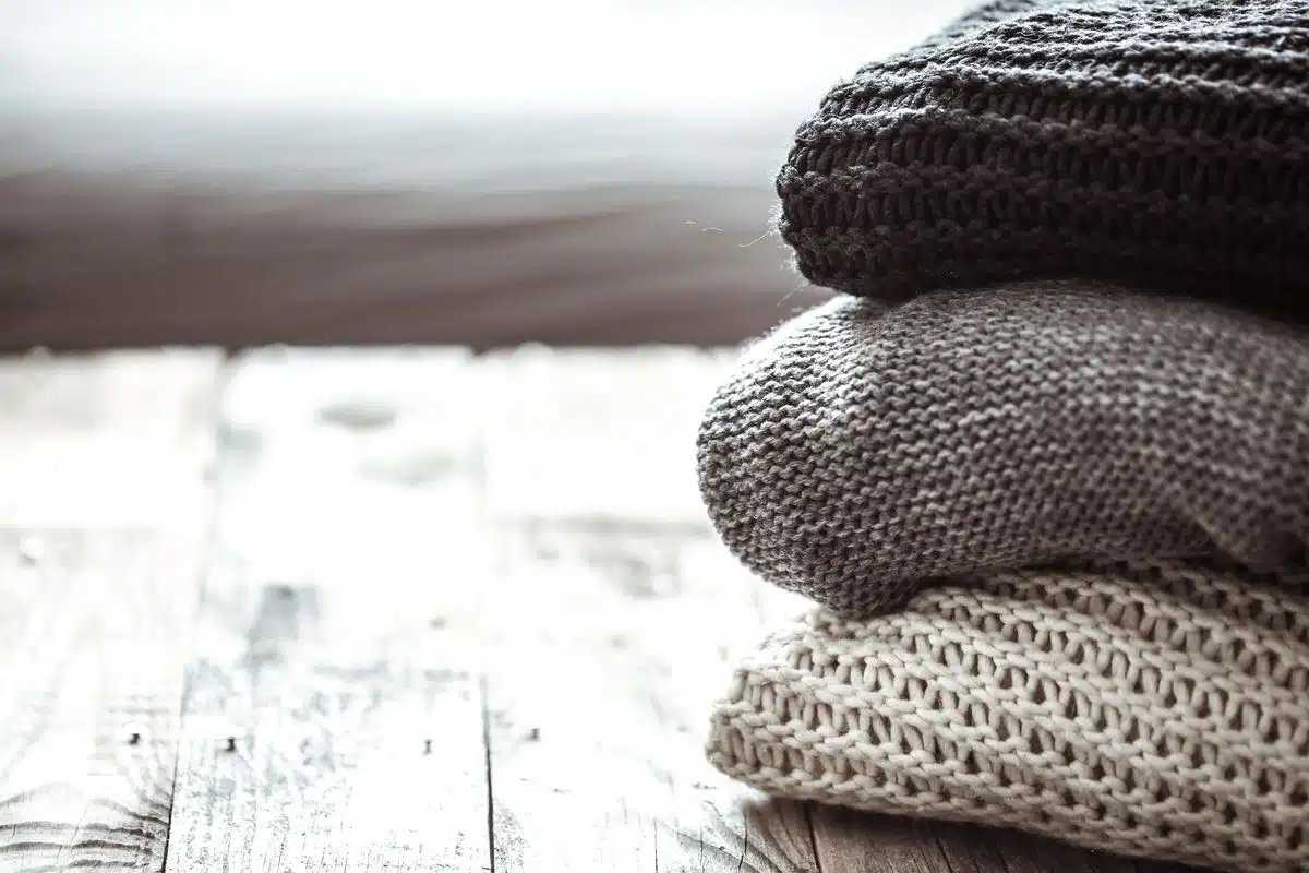 Stack of folded knitted wool sweaters