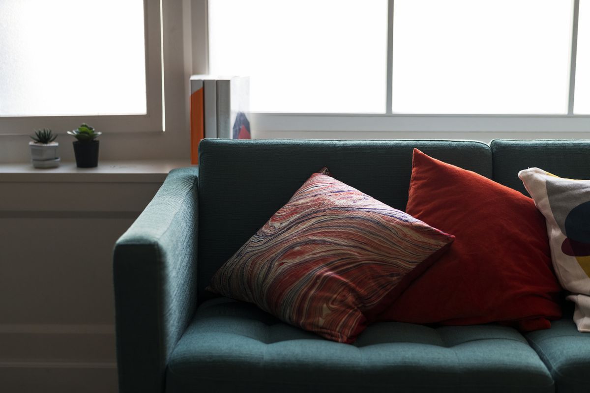 Close-up of the woven fabric of an upholstered sofa seat and its cushion