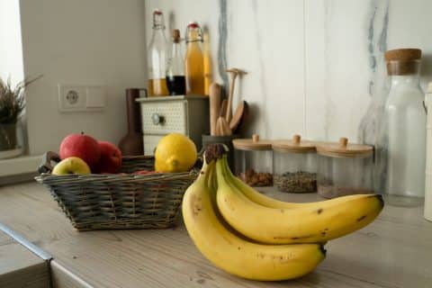Basket of fresh fruit left out on a kitchen table